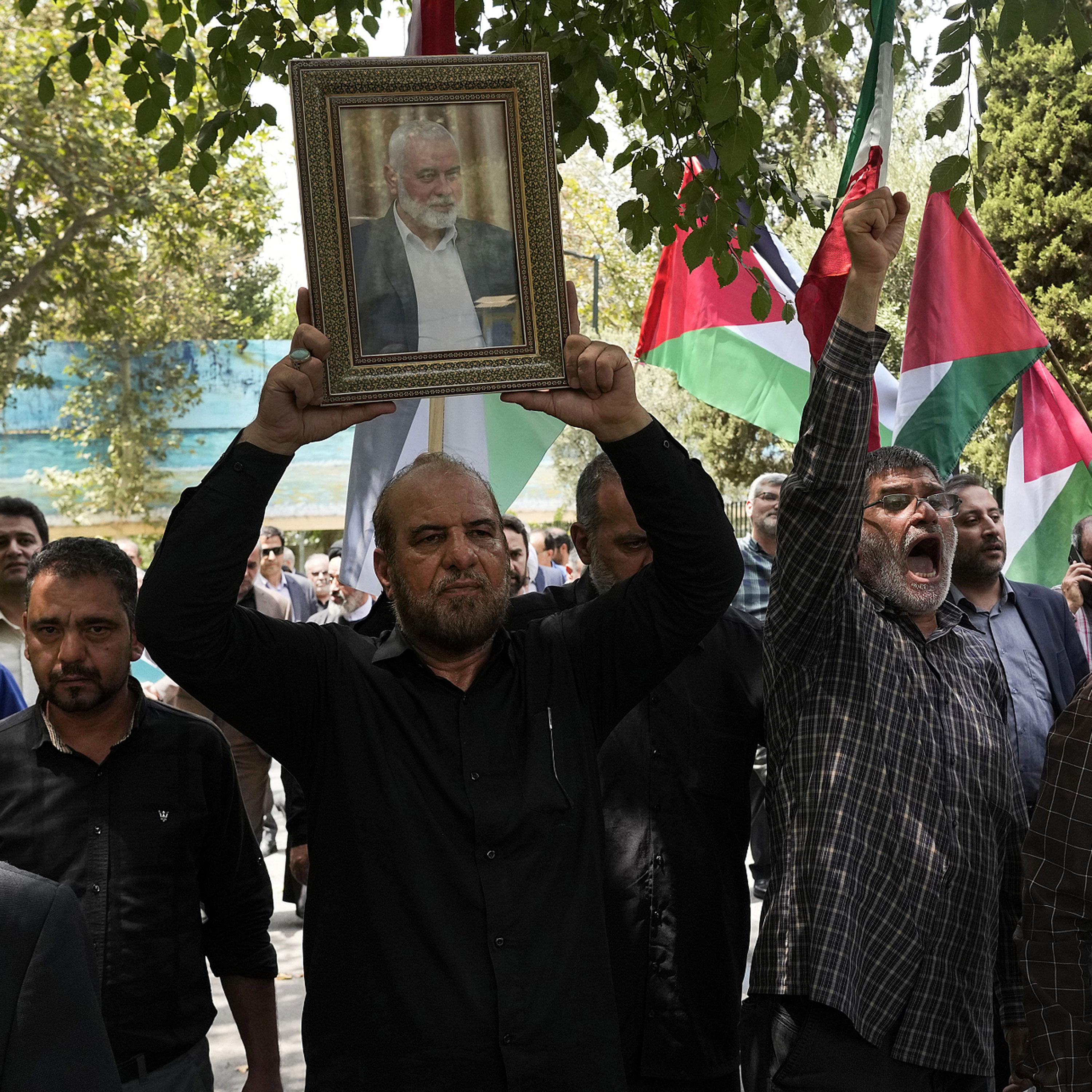 Iran vows retaliation for killing of Hamas chief, while Israel signals readiness