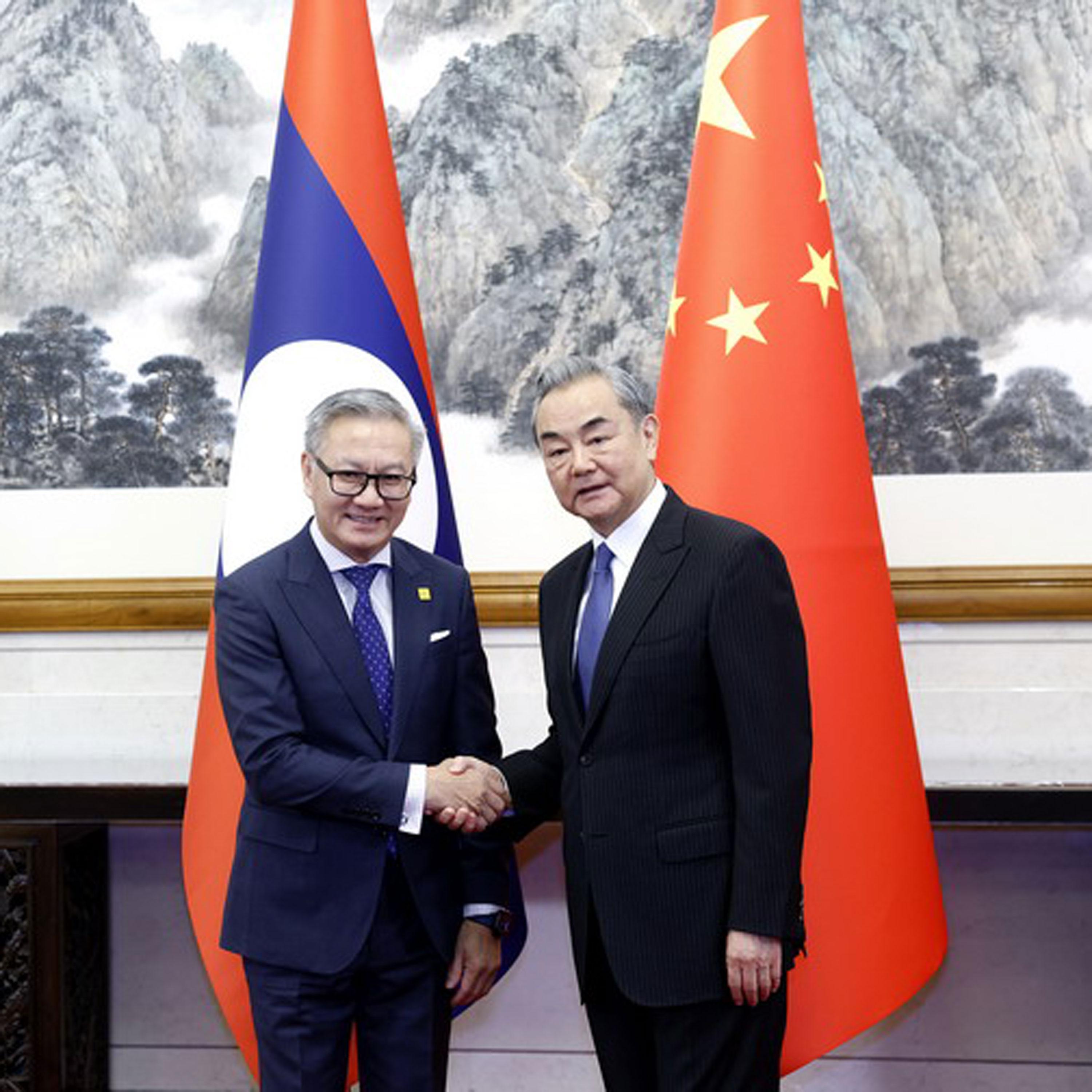 Wang Yi meets Lao counterpart in Beijing