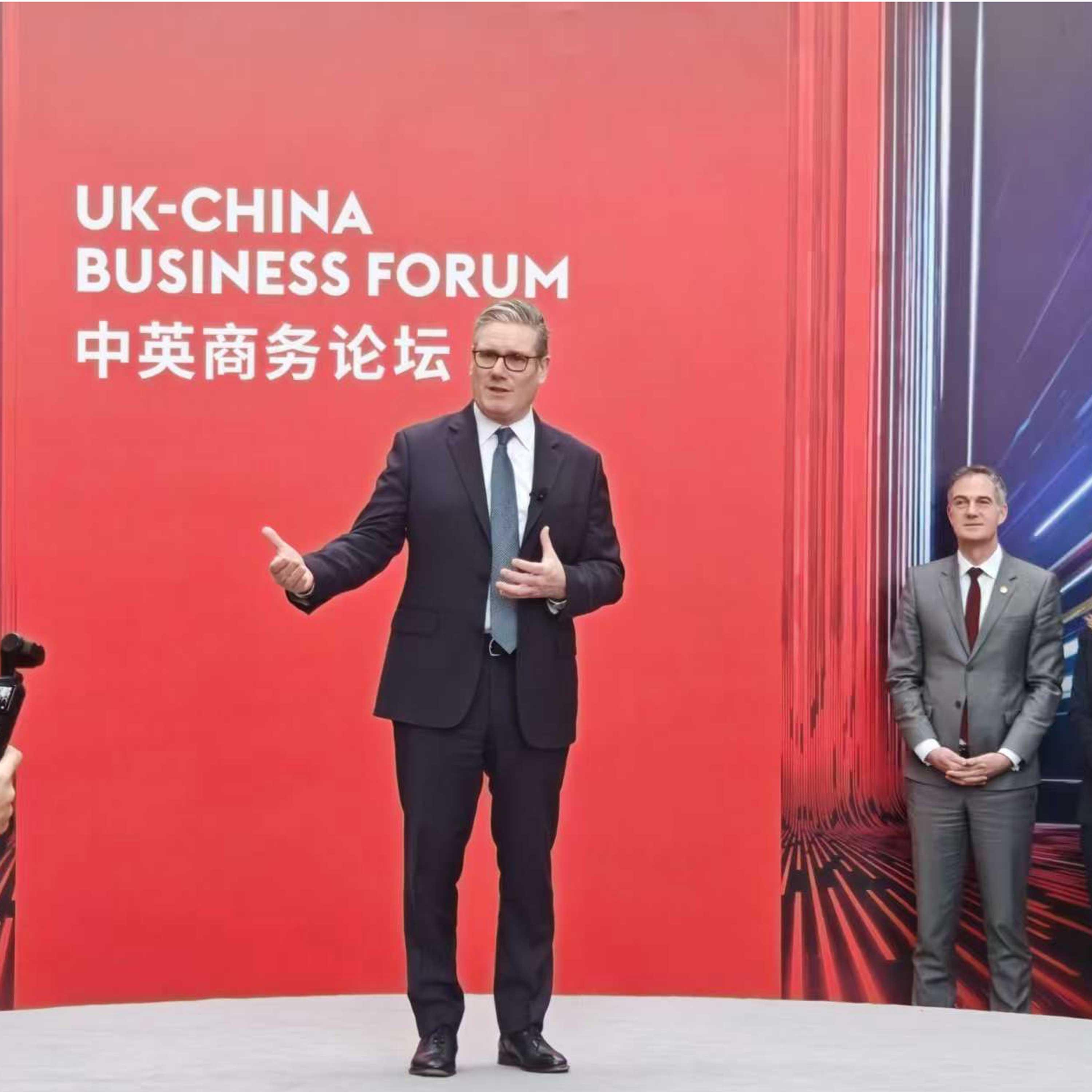 British PM attends business forum stressing dialogue